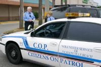 Citizens on Patrol Talking Behind Citizens on Patrol Vehicle