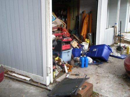 Large piles of junk are visible on personal property.